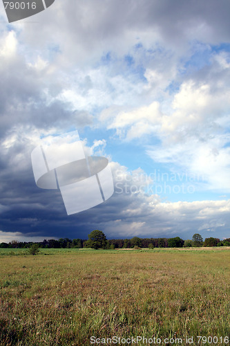 Image of Storm clouds over the field