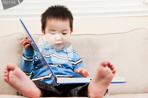 Image of Boy reading a book