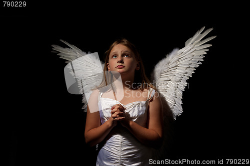 Image of little angel girl at night