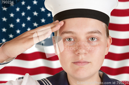 Image of young sailor saluting in front of US flag