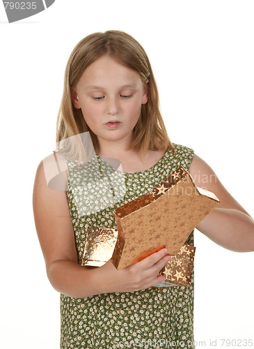 Image of girl opening present on white