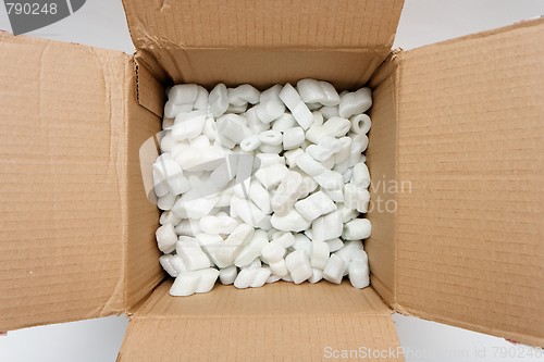 Image of A cardboard box with packing foam pellets top view