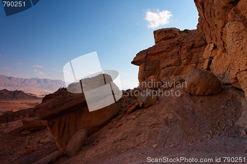 Image of Scenic weathered orange rock in stone desert on sunset