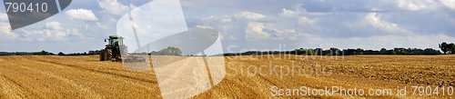Image of harvested field with tractor