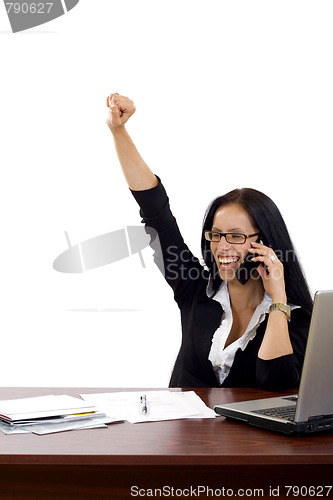 Image of attractive businesswoman on the phone winning