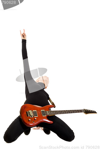 Image of girl playing an electric guitar on her knees