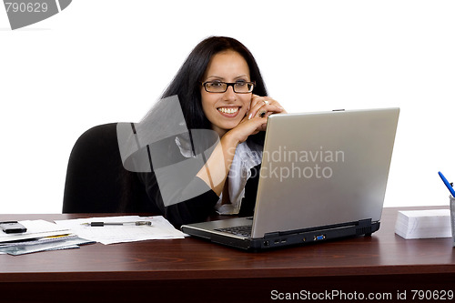 Image of business woman working at her desk with a laptop