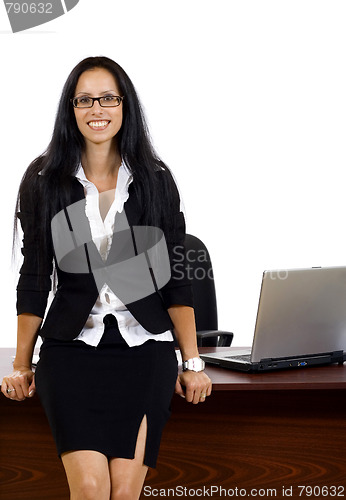 Image of business woman against desk