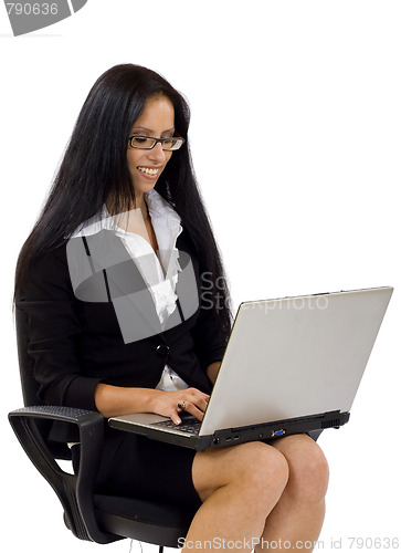 Image of businesswoman in chair with laptop computer 