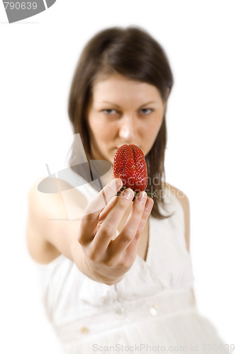 Image of sexy young woman holding fresh strawberry