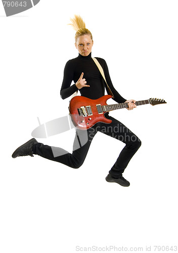 Image of headbanging woman guitarist jumps