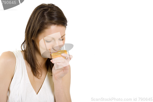 Image of young woman with orange slice
