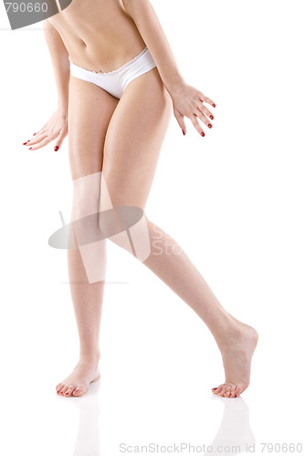 Image of shy woman in bare feet over white