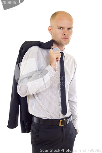 Image of Serious young man  with coat on shoulde