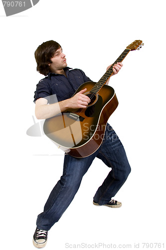 Image of man playing his acoustic guitar