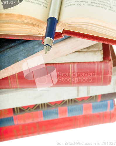 Image of old books and pen