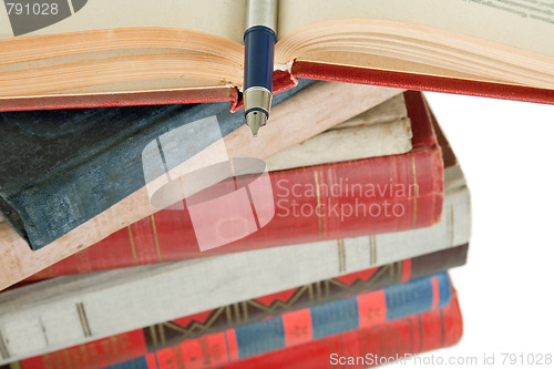 Image of old books and pen