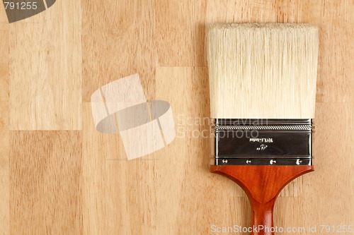 Image of Paint Brush on Wood Surface