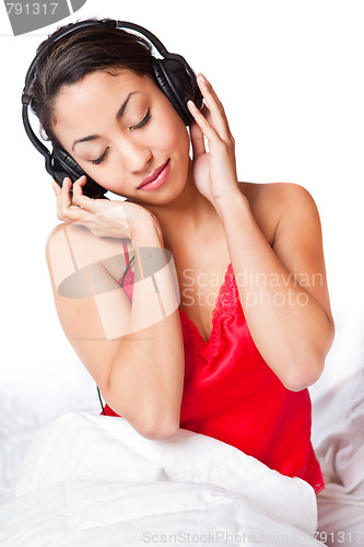 Image of Woman listening to music