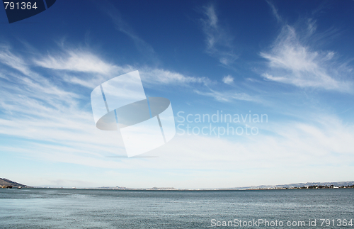 Image of Blue sky with clouds over sea