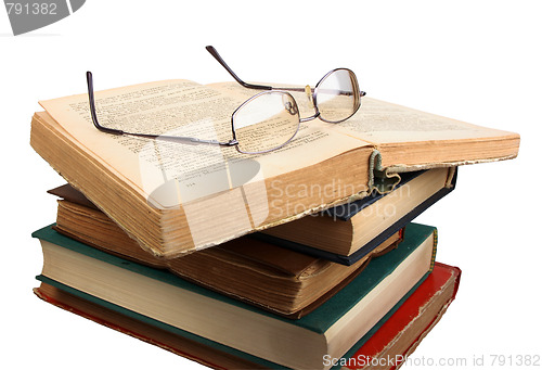 Image of Glasses and open books.