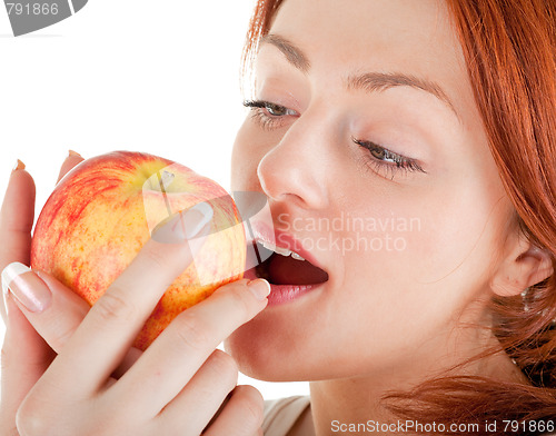 Image of redhead girl with apple