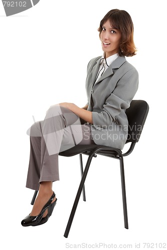 Image of young girl in office clouses