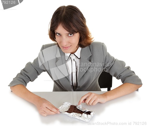 Image of young girl with a chocolate bar in his hand