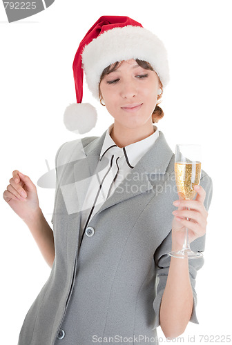 Image of business girl in Santa hat and with champagne