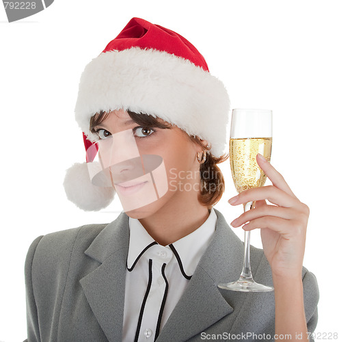 Image of business girl in Santa hat and with champagne