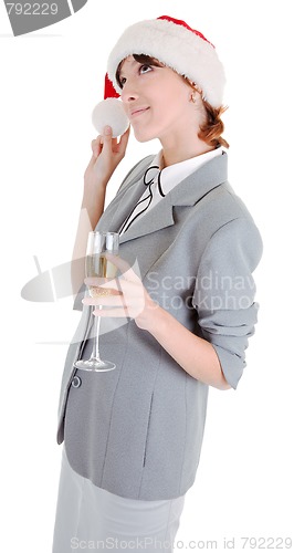 Image of business girl in Santa hat and with champagne