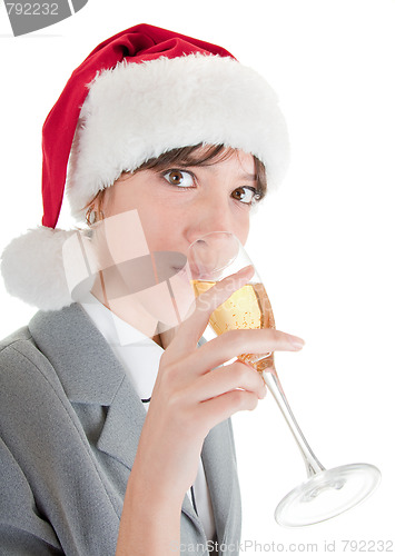 Image of business girl in Santa hat and with champagne