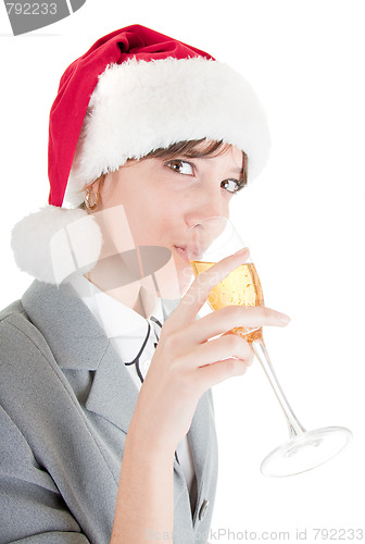 Image of business girl in Santa hat and with champagne