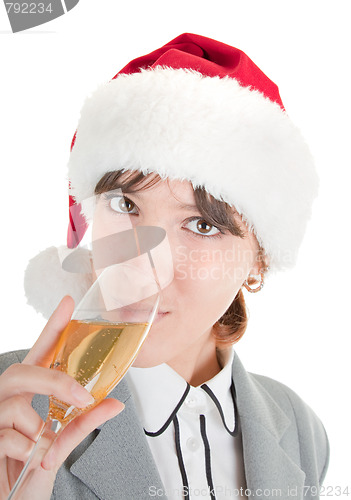 Image of business girl in Santa hat and with champagne