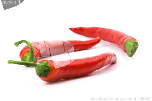 Image of three red chili peppers