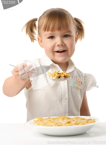 Image of Girl showing spoon filled with corn flakes