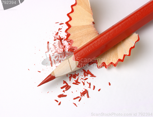 Image of Sharpened red crayon on shavings