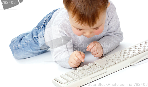 Image of Cute child typing on a keyboard