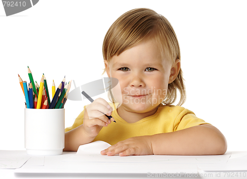 Image of Child draw with crayons and smile