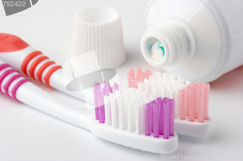 Image of Two toothbrushes and toothpaste