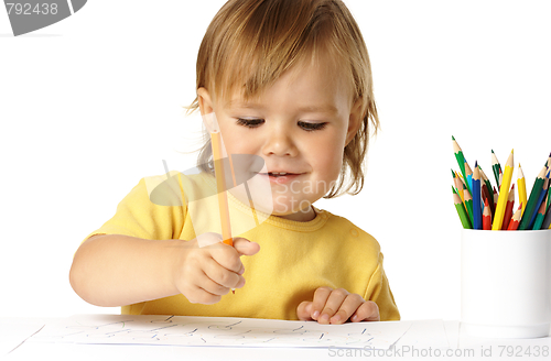 Image of Happy child draw with crayons and smile