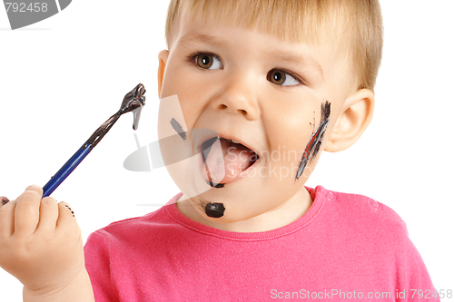 Image of Little girl play with paints