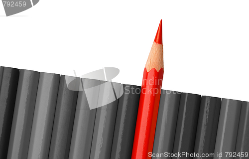 Image of Single red crayon is sticking out of the gray row