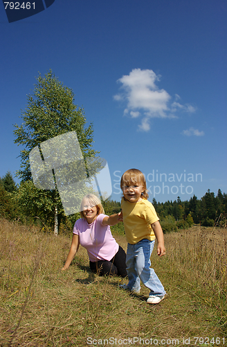 Image of Mother and child play outdoors