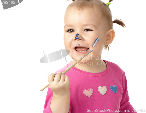 Image of Little girl paint on her cheek