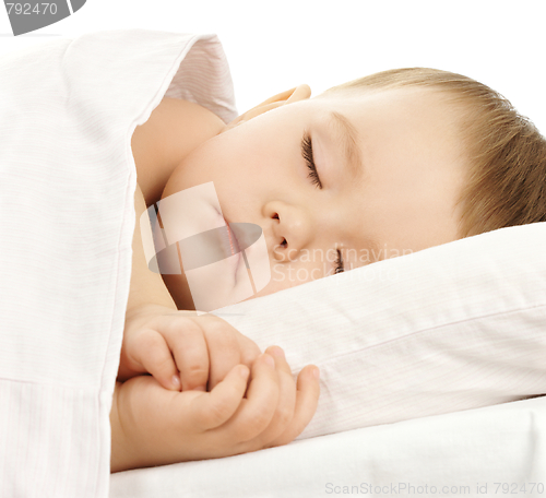 Image of Cute child is sleeping in bed