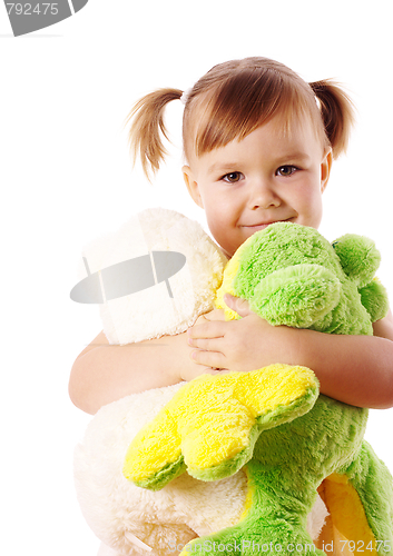 Image of Cute girl embracing her soft toys