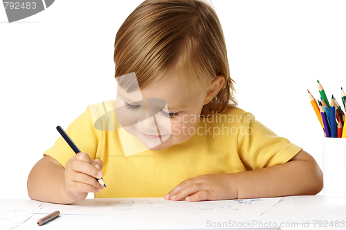 Image of Playful child draw with crayons and smile
