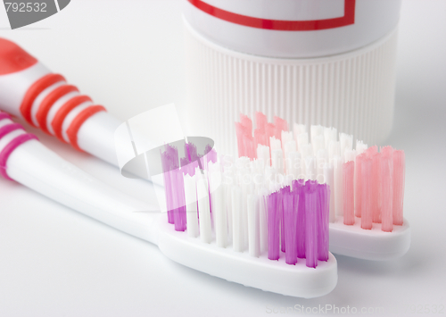 Image of Two toothbrushes and toothpaste