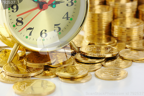 Image of Time is money - clock dial and golden coins